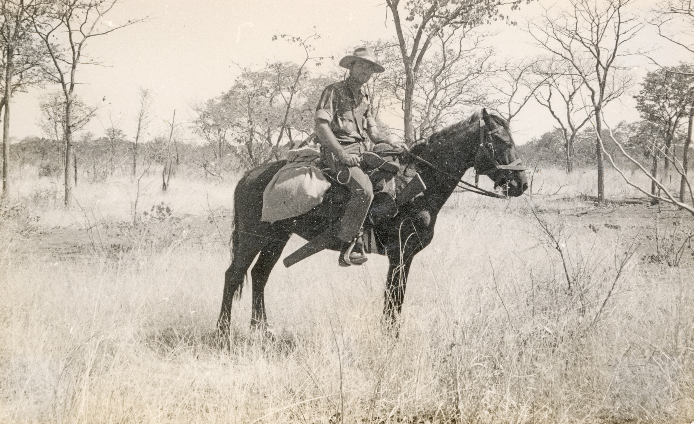 Allan Savory on a horse in the African bush